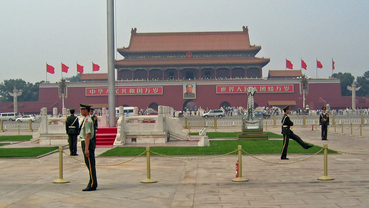 Building in China with guards in front.
