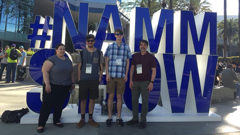 Students by NAMM sign