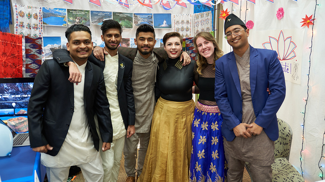 UE international students posing together at the International Bazaar