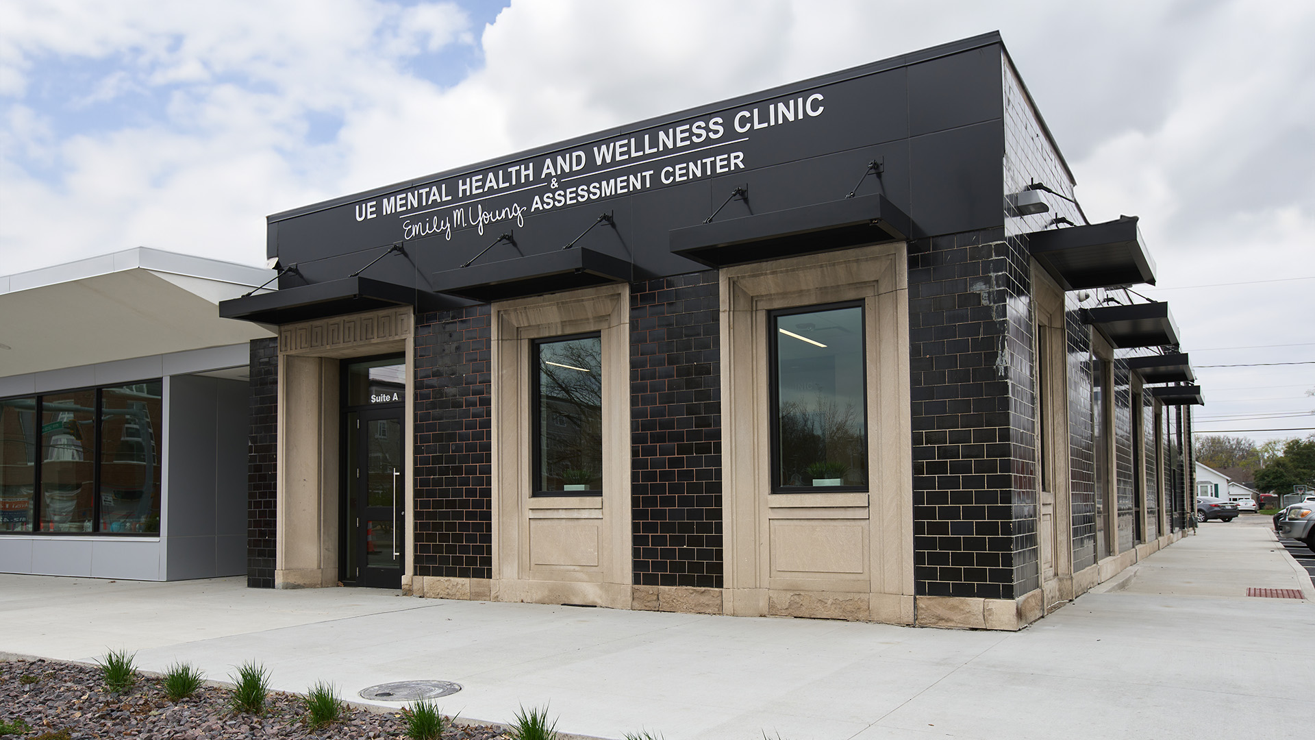 Mental Health and Wellness Clinic in partly cloudy sky